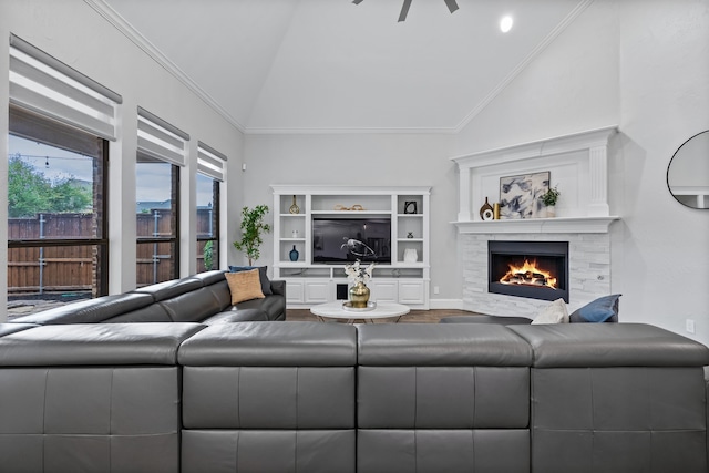 living room with crown molding, hardwood / wood-style flooring, and vaulted ceiling