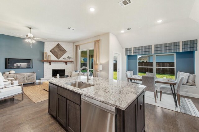 kitchen with dark brown cabinetry, sink, plenty of natural light, and dishwasher