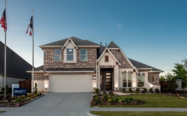 view of front facade with a garage and a front yard