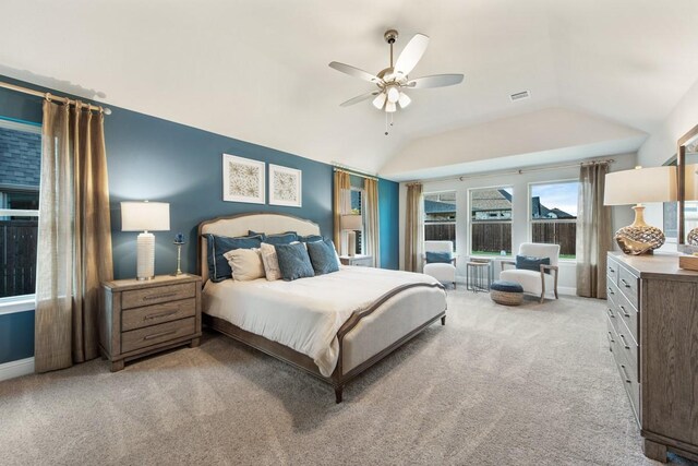 bedroom with lofted ceiling, light carpet, and ceiling fan