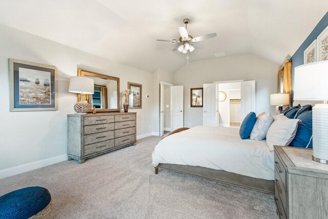 carpeted bedroom with lofted ceiling and ceiling fan