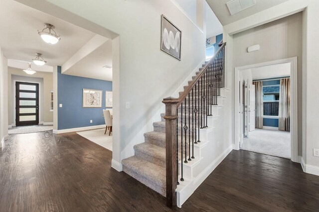 foyer with dark wood-type flooring