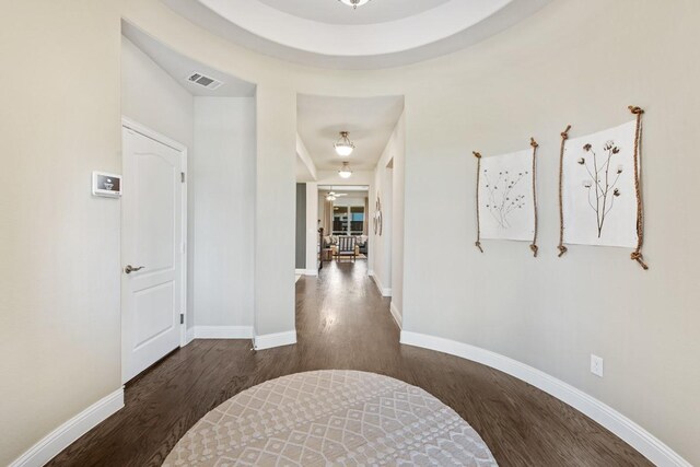 hall with dark wood-type flooring