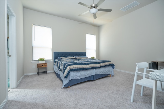 bedroom featuring light carpet and ceiling fan