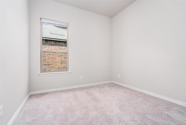 empty room featuring light carpet