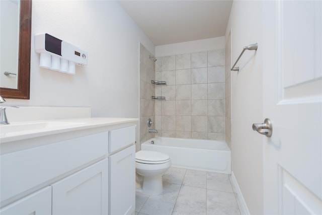 full bathroom featuring vanity, tile patterned flooring, toilet, and tiled shower / bath