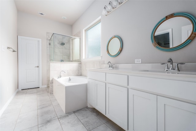 bathroom featuring vanity and shower with separate bathtub