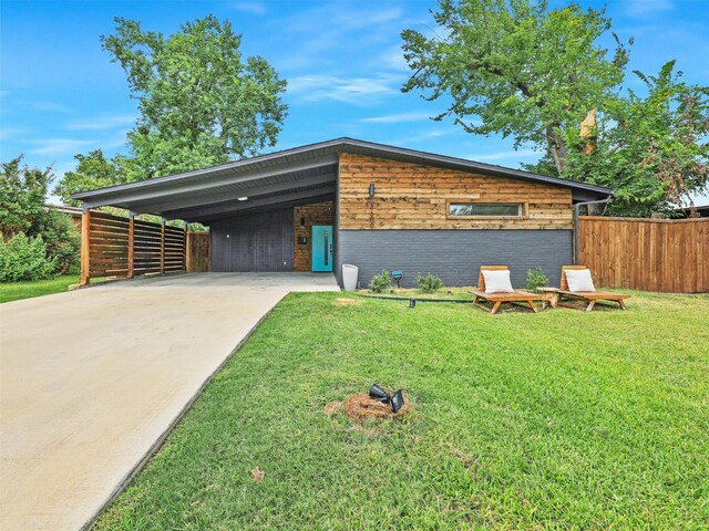 contemporary house with a carport and a front yard