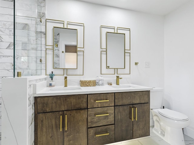 bathroom with tile patterned flooring, vanity, walk in shower, and toilet