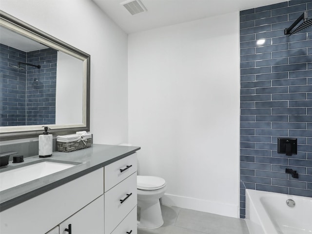 full bathroom featuring vanity, toilet, tiled shower / bath combo, and tile patterned flooring