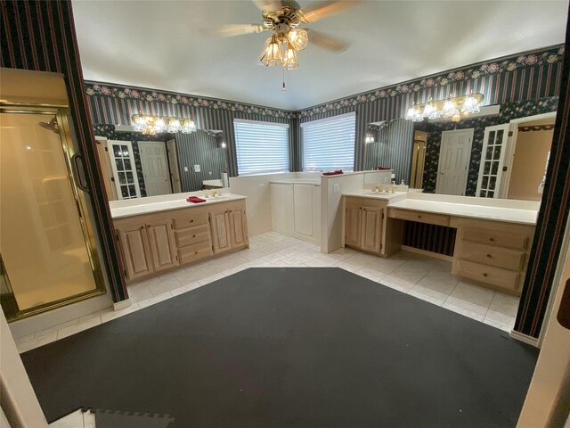 full bath featuring wallpapered walls, a ceiling fan, a sink, a stall shower, and tile patterned flooring