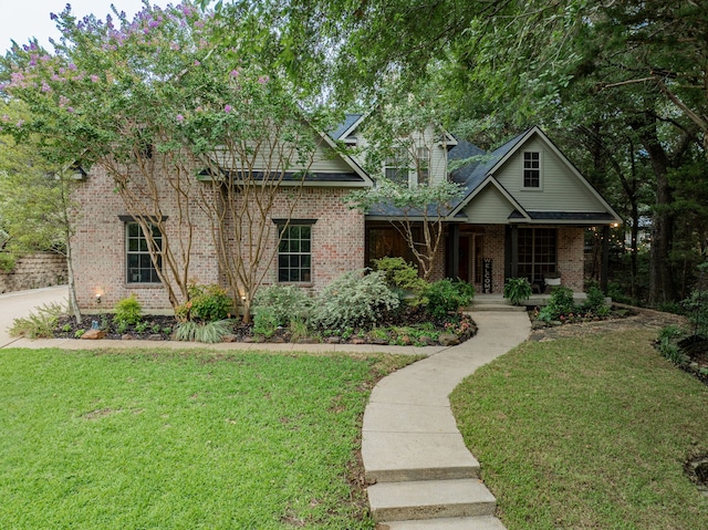 view of front of house with a front yard and covered porch