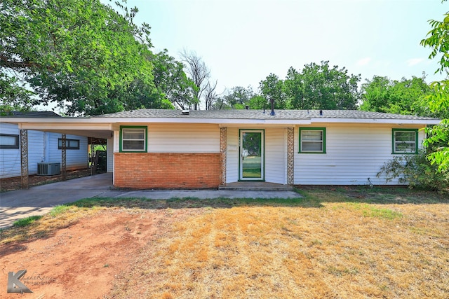 ranch-style house featuring a carport and a front yard