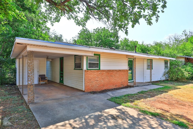 ranch-style house with a carport