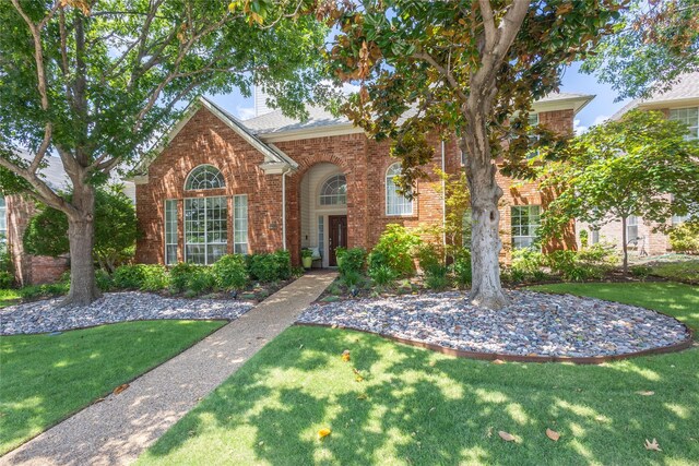 view of property featuring a front yard