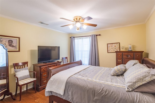 bedroom featuring ceiling fan, wood-type flooring, and ornamental molding