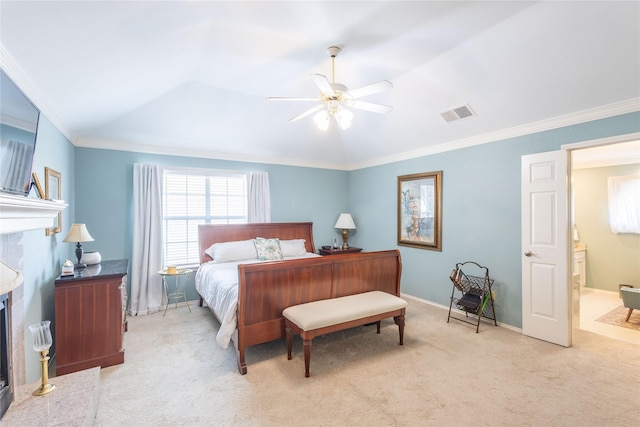 bedroom with ceiling fan, ornamental molding, ensuite bathroom, and light carpet