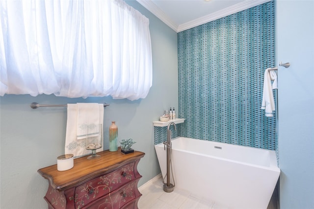 bathroom featuring tile patterned flooring, crown molding, and a bathtub