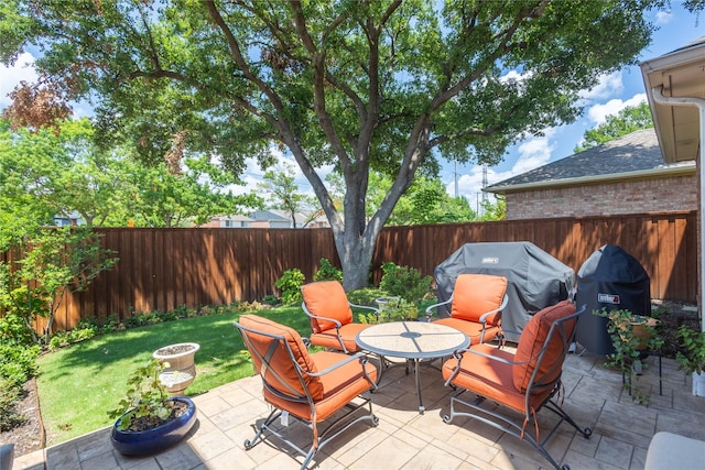 view of patio with a grill