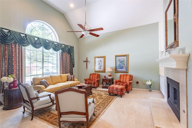 carpeted living room featuring ceiling fan, lofted ceiling, and a fireplace