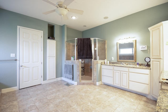 bathroom with ceiling fan, tile patterned floors, vanity, and an enclosed shower