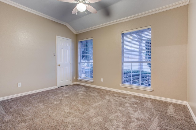 carpeted empty room with crown molding, ceiling fan, and lofted ceiling