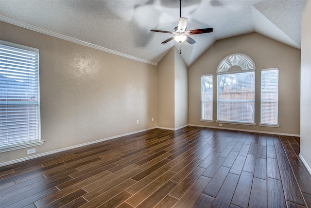 spare room featuring lofted ceiling, a textured ceiling, and ceiling fan