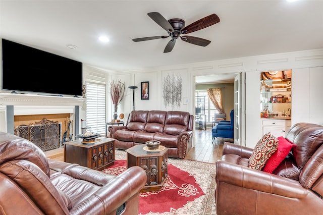 tiled living room featuring ceiling fan