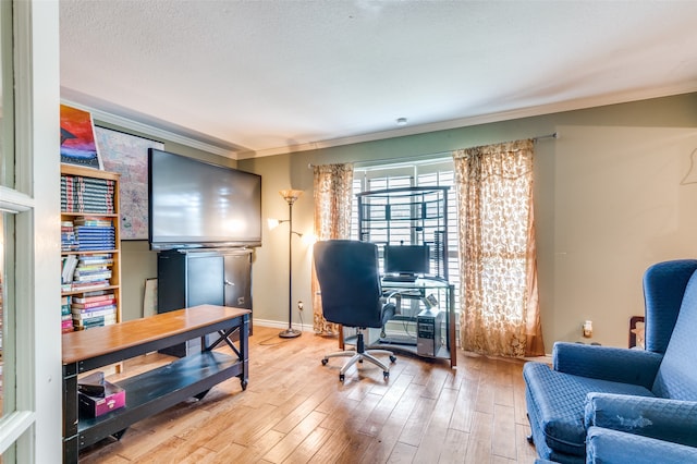 office space with wood-type flooring and crown molding