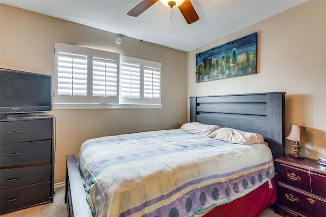 bedroom featuring light colored carpet and ceiling fan