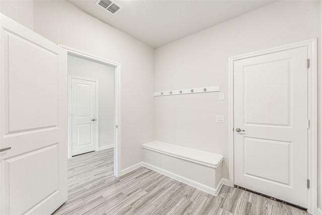 mudroom with light hardwood / wood-style floors