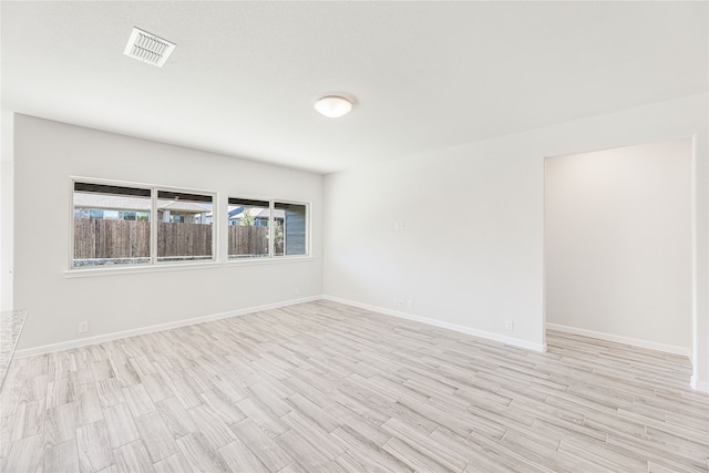 empty room with light wood-type flooring