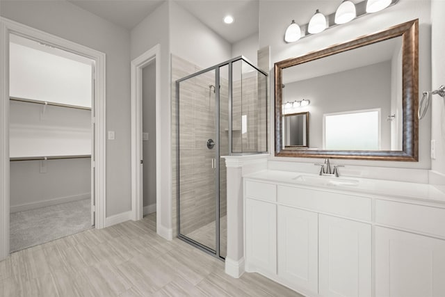 bathroom featuring vanity and walk in shower