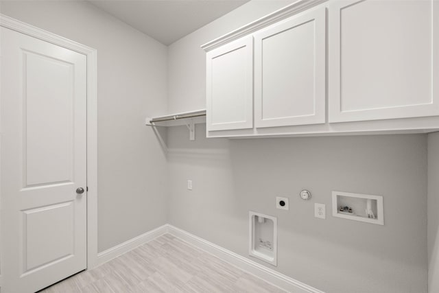 laundry area featuring washer hookup, gas dryer hookup, cabinets, and electric dryer hookup