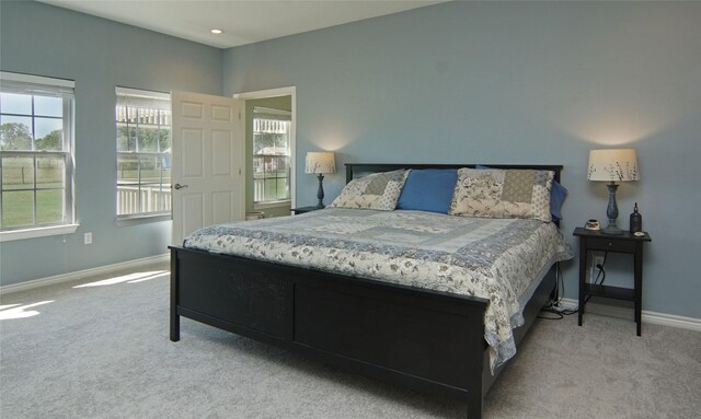 bedroom featuring light colored carpet