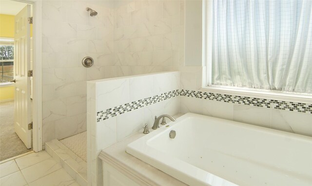 bathroom featuring independent shower and bath and tile patterned flooring