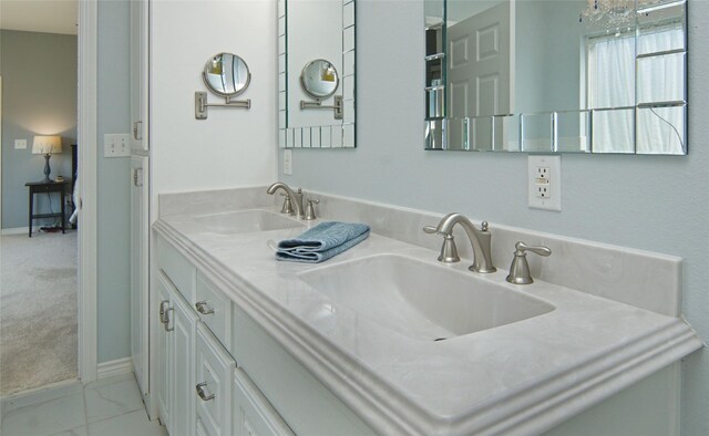 bathroom with tile patterned flooring and double vanity