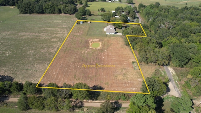 birds eye view of property featuring a rural view