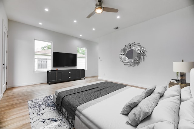 bedroom featuring ceiling fan and light hardwood / wood-style floors