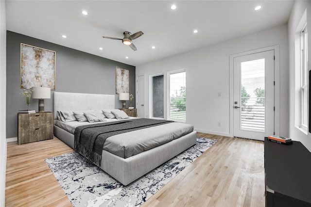 bedroom with access to outside, ceiling fan, and light wood-type flooring