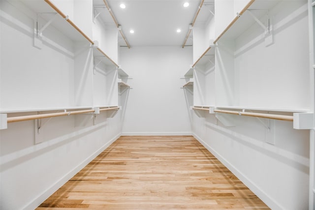 spacious closet featuring light hardwood / wood-style flooring