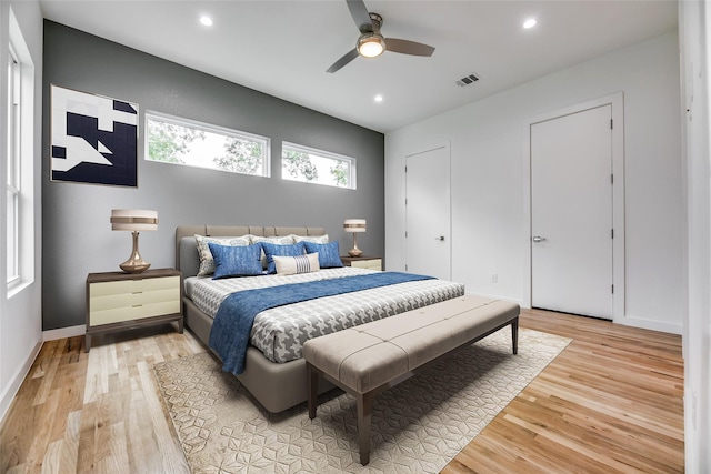 bedroom with wood-type flooring and ceiling fan