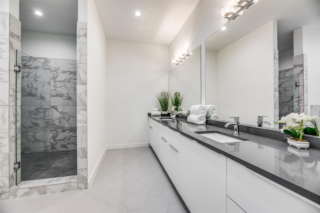 bathroom with vanity and a shower with shower door