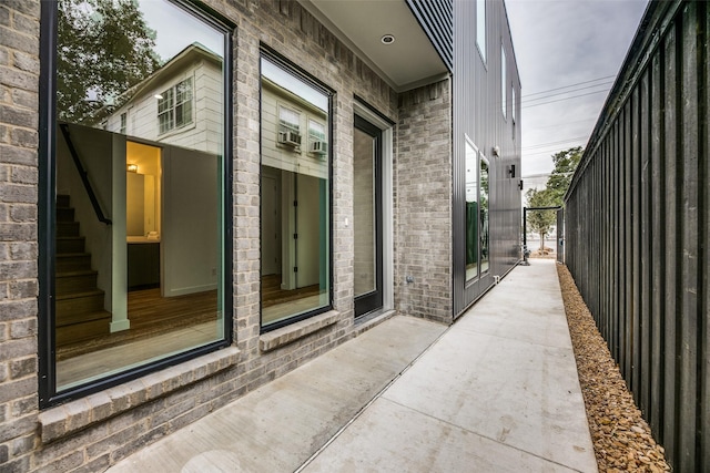 view of side of home with a patio area