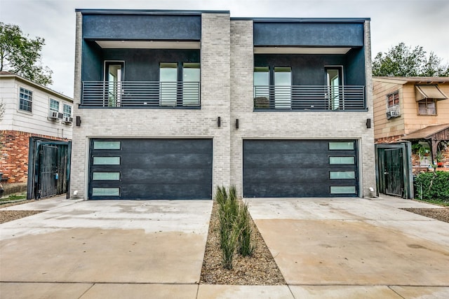 modern home with cooling unit, a balcony, and a garage