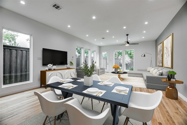 dining space with light hardwood / wood-style floors and ceiling fan