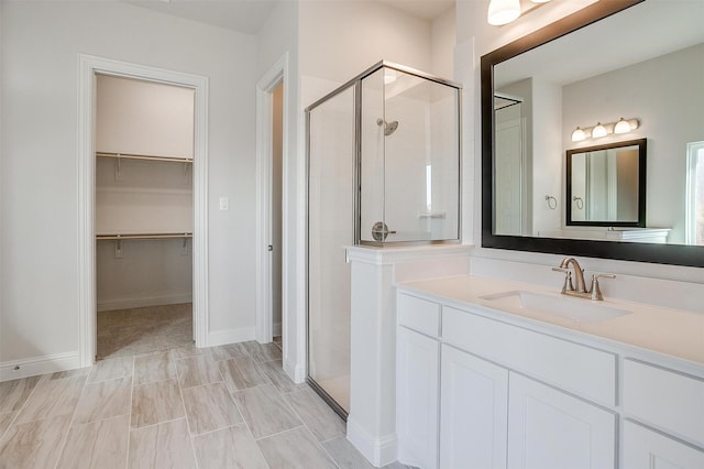 bathroom with vanity and walk in shower