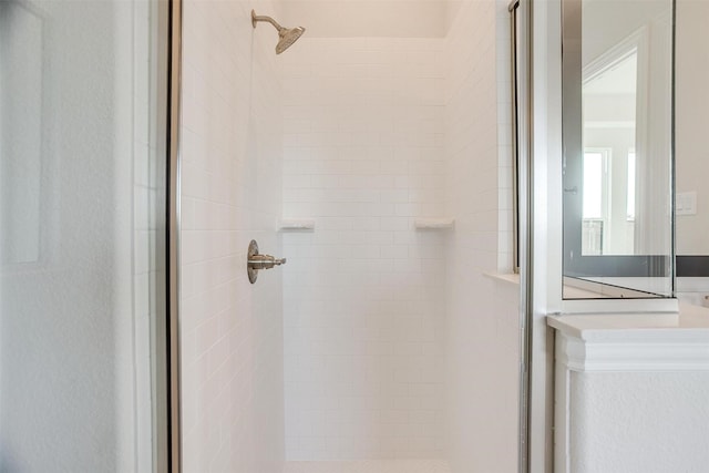 bathroom with a tile shower