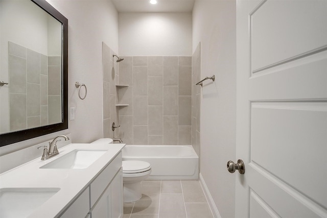 full bathroom with vanity, tiled shower / bath combo, tile patterned floors, and toilet