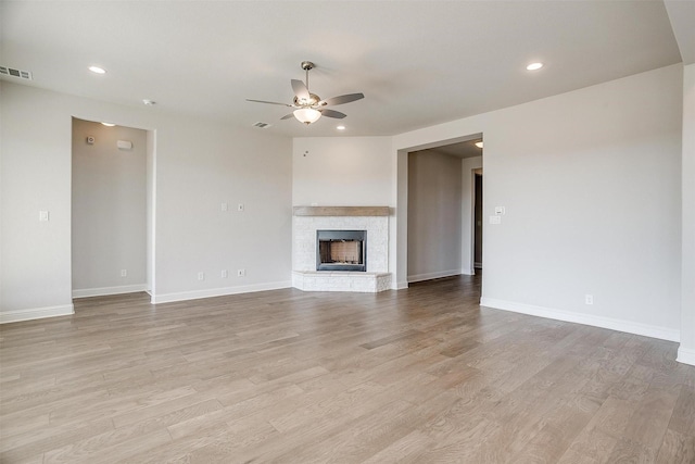 3834 Foot Hls, Midlothian, TX 76065 - unfurnished living room featuring light wood-style flooring, baseboards, a ceiling fan, and visible vents